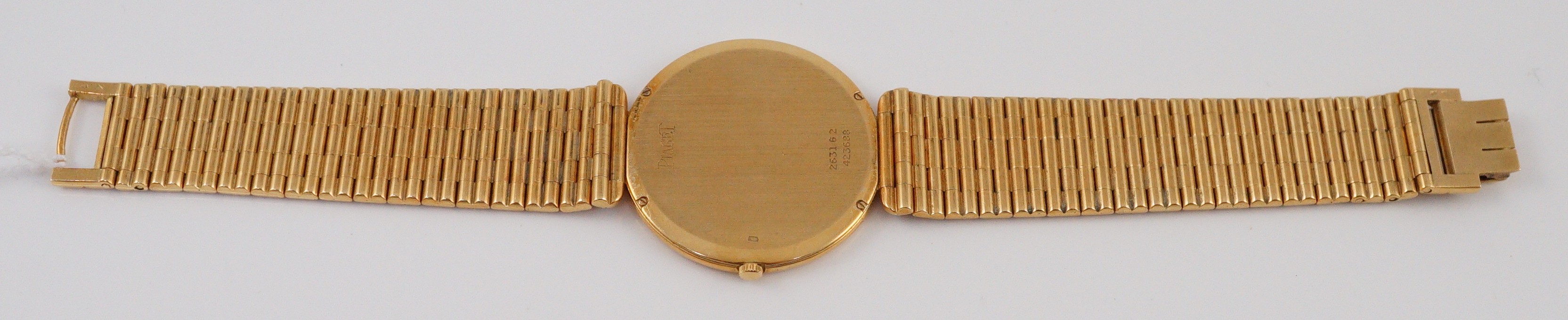 A gentleman's 18ct gold Piaget manual wind dress wrist watch, on an 18ct gold Piaget bracelet